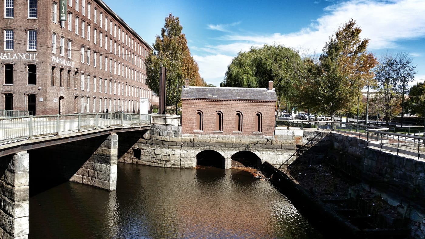 Canal and brick mill buildings in Lowell, Massachusetts